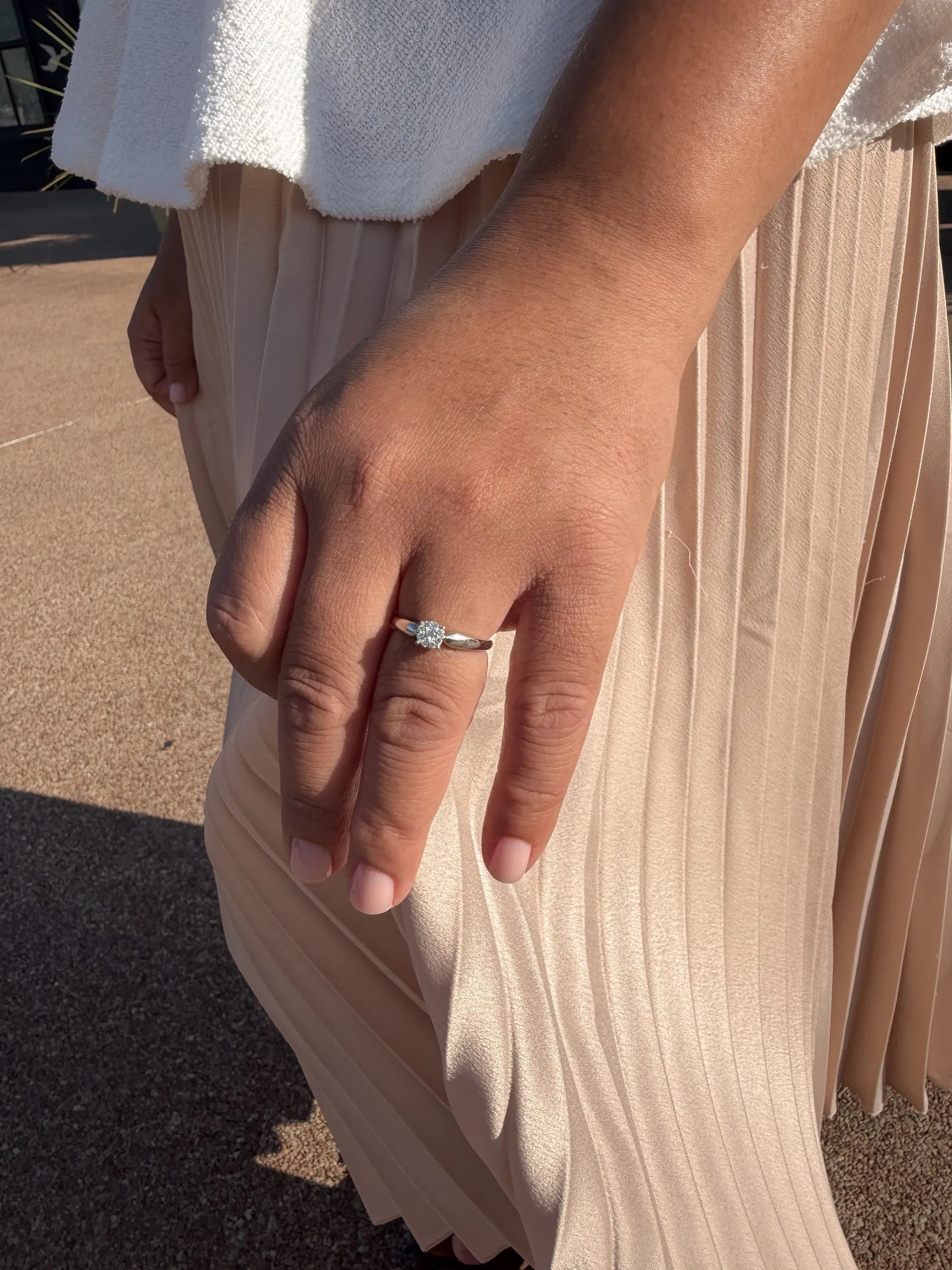Mathelle's hand and engagement ring in the evening light