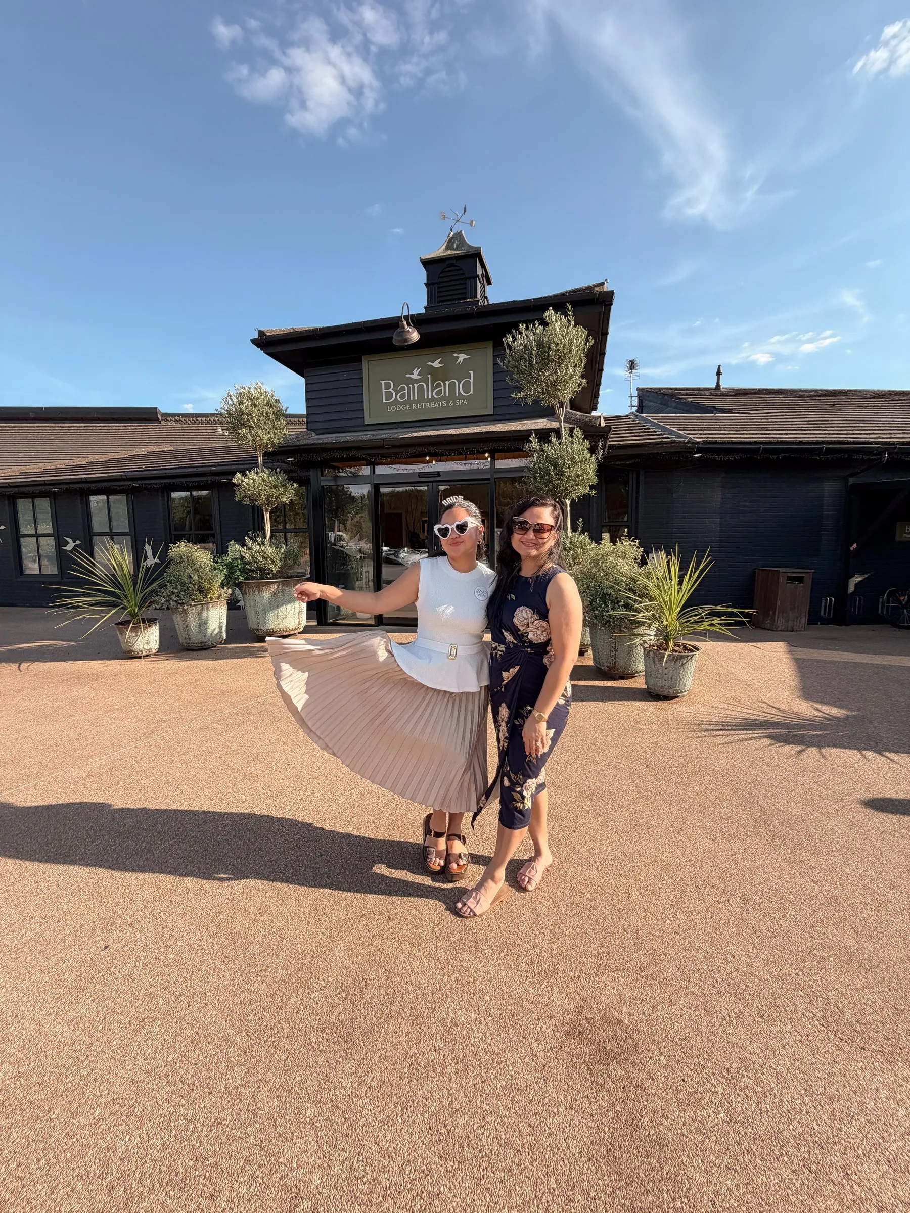 Mathelle swishing her skirt beside a friend at the lodge