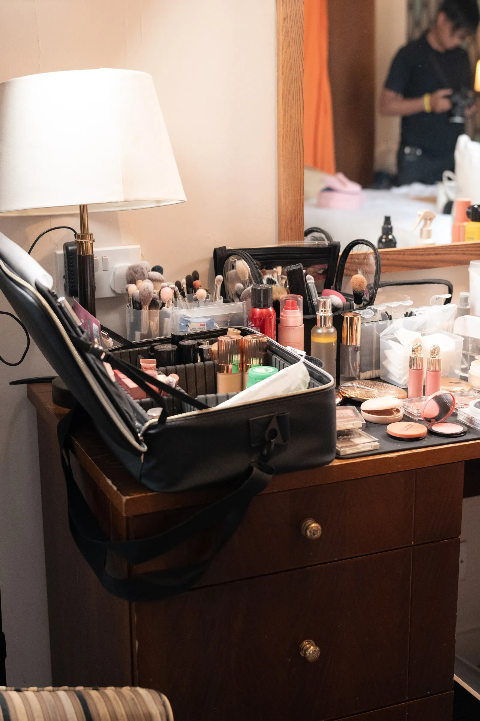 Makeup laid out on a dresser in the bridal suite
