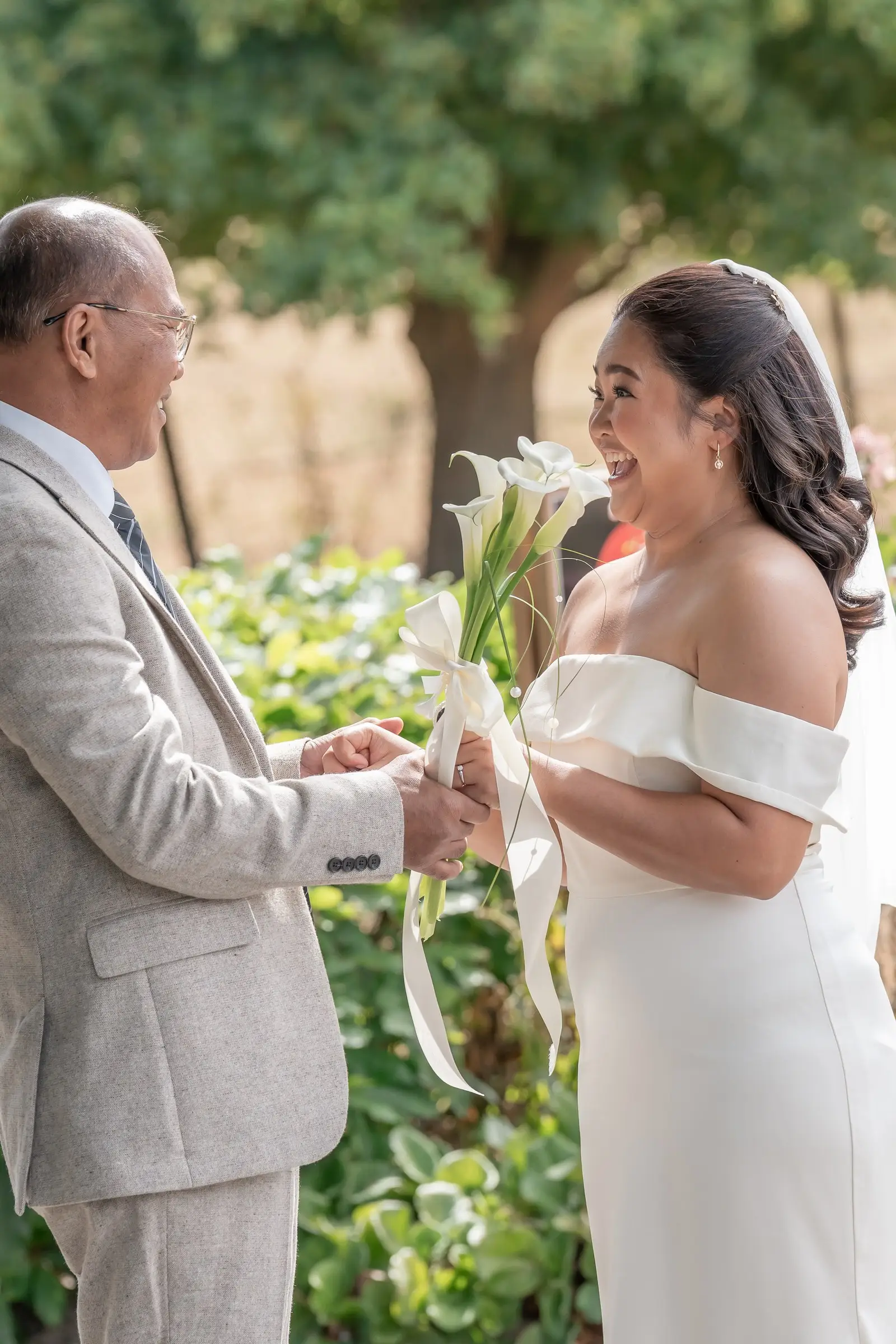Mathelle holding her dad's hands and laughing after their first look at Rothley Court
