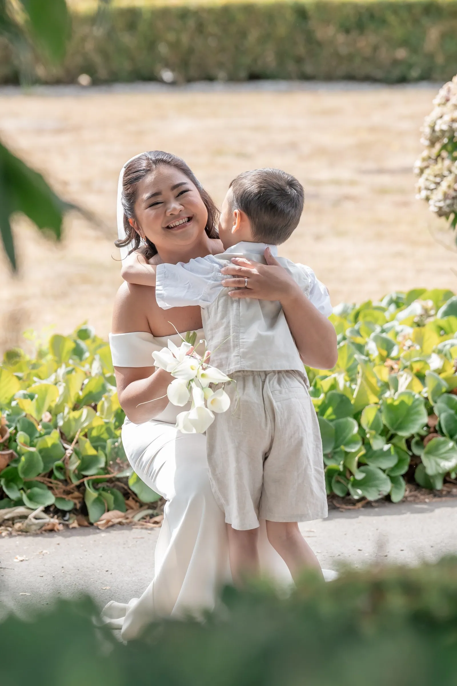 Mathelle hugging her son during their first look