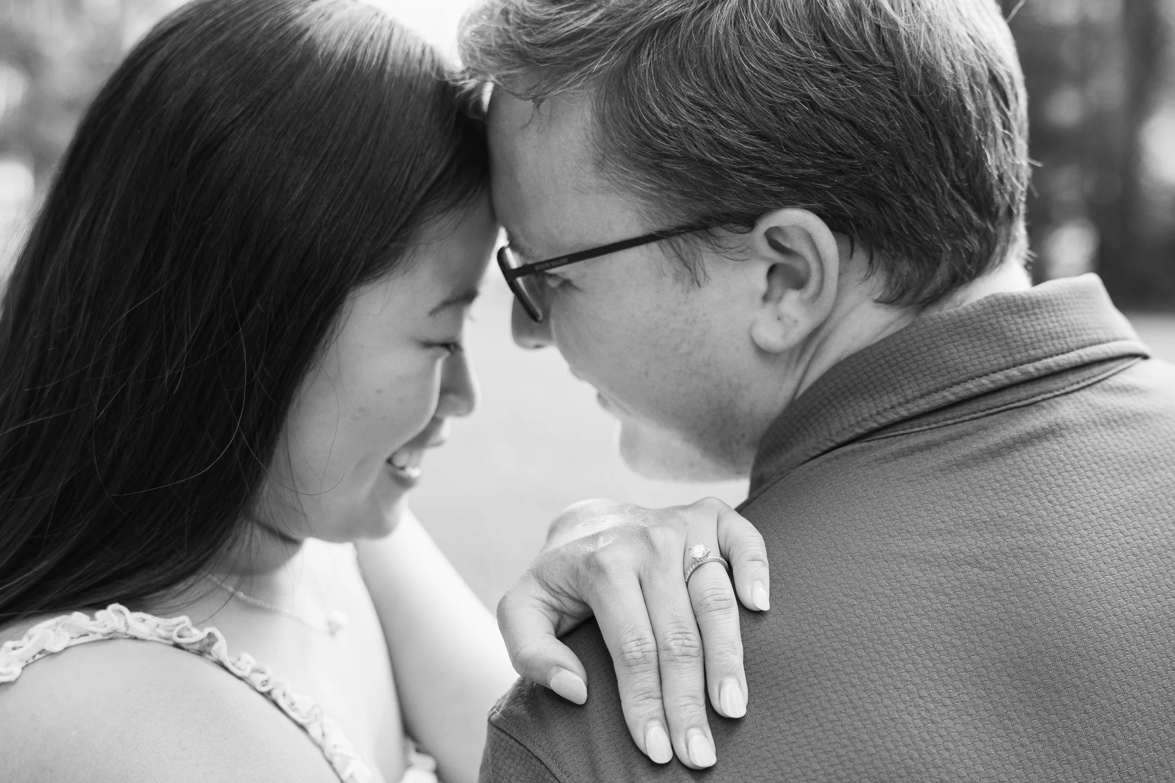 Black and white frame of Mya and Jacob with their foreheads together