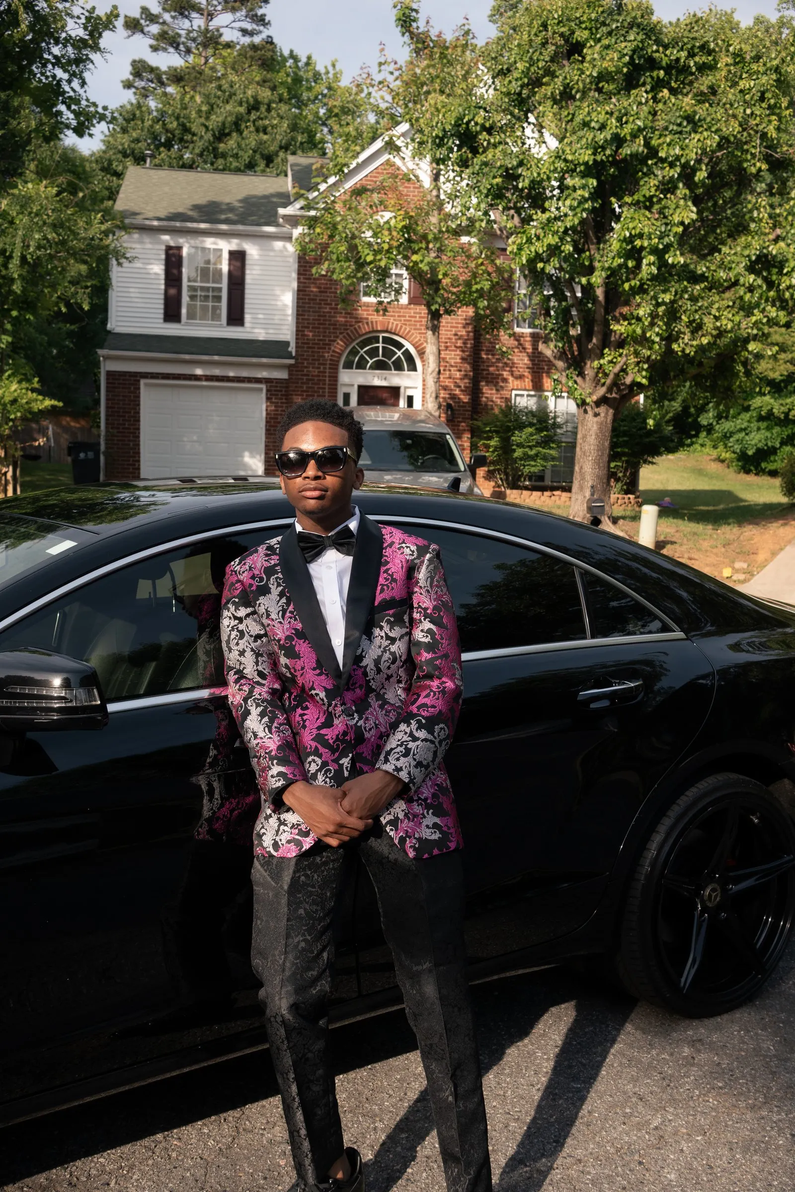 Full length prom portrait beside the black Mercedes