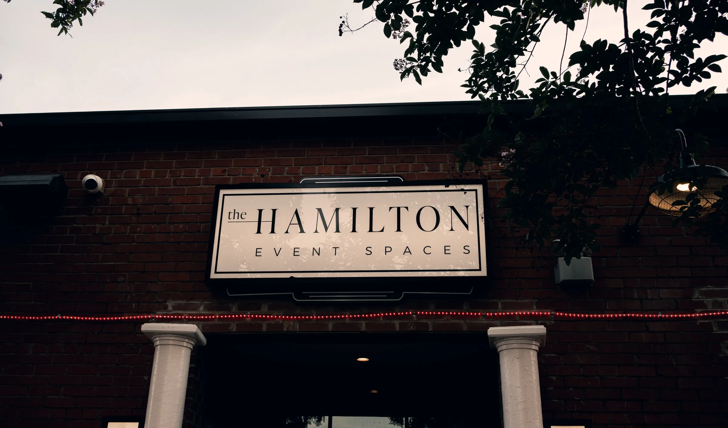 The Hamilton Event Spaces sign above the entrance in North Charlotte