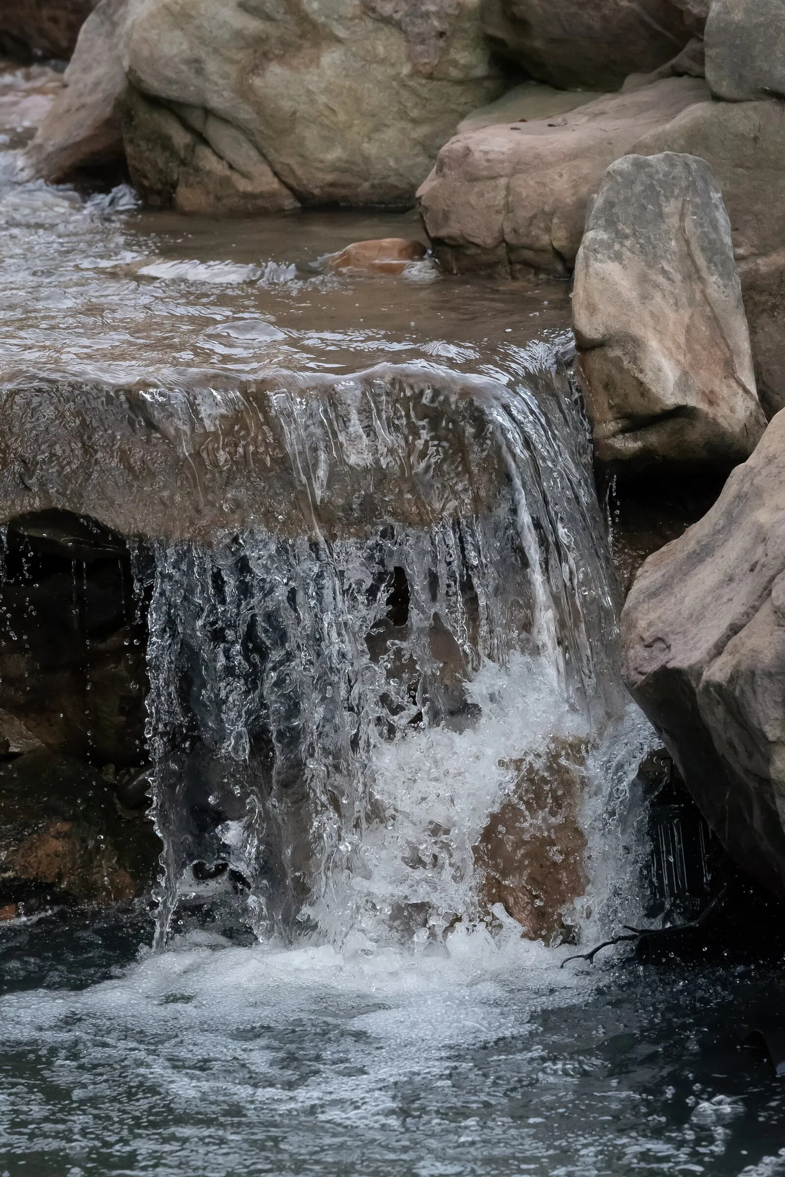 Close-up of the waterfall spilling over the rocks at Millbridge